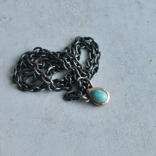 Variscite stone necklace with rose gold frame on dark sterling