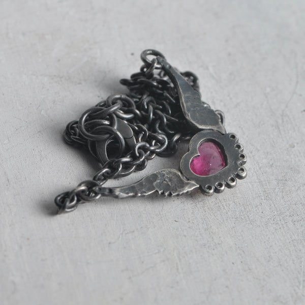 flying heart necklace in 14k gold and pink tourmaline