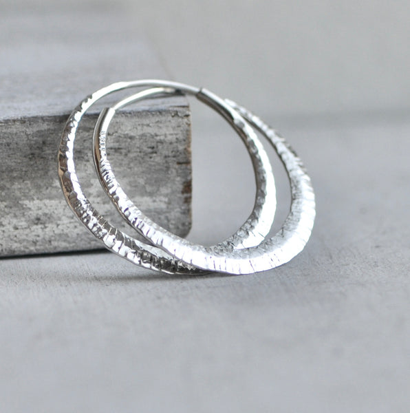 endless hoop earring with woodsmith texture