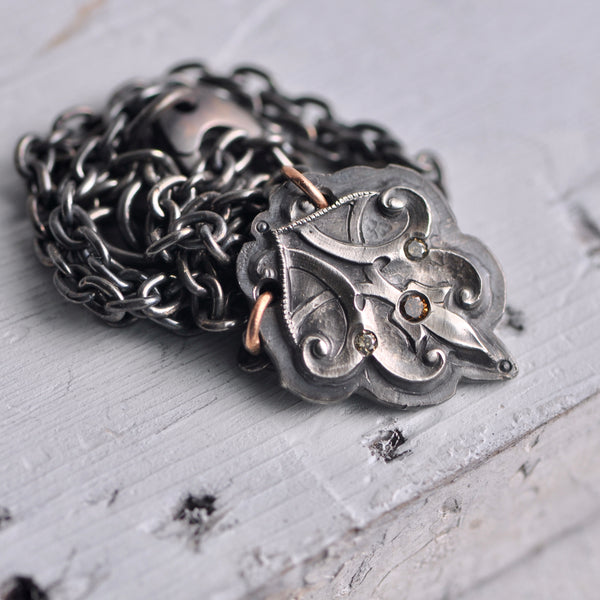 forged sterling pendant with flush set diamonds