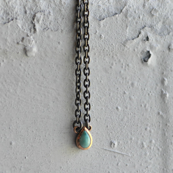 Variscite stone necklace with rose gold frame on dark sterling