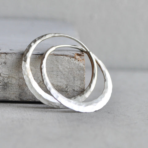 endless hoop earring with ball pein texture and matte finish