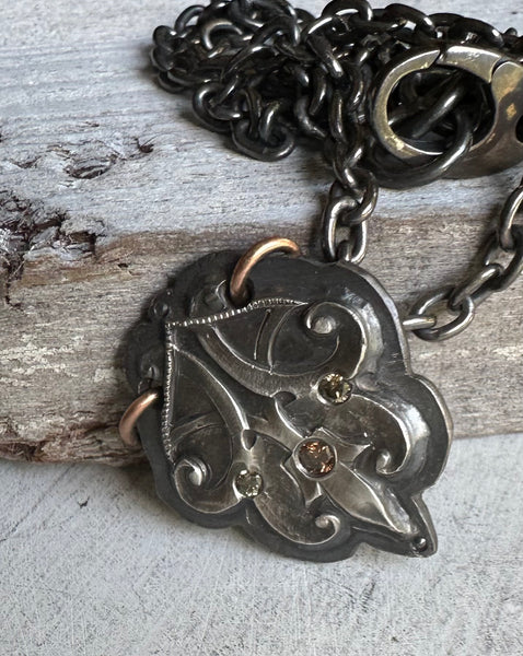 forged sterling pendant with flush set diamonds
