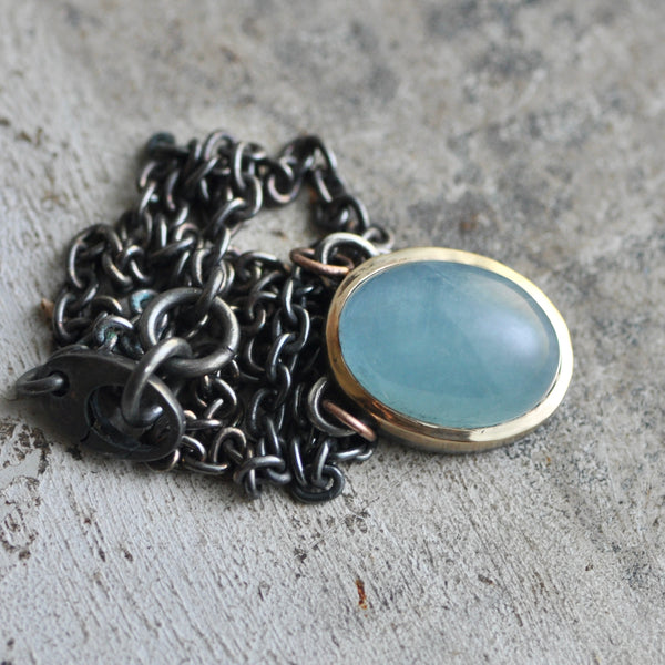 cats eye aquamarine pendant in sterling silver and 14k gold